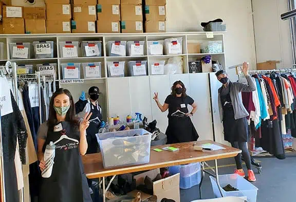 Three Volunteers with the Suiting Department