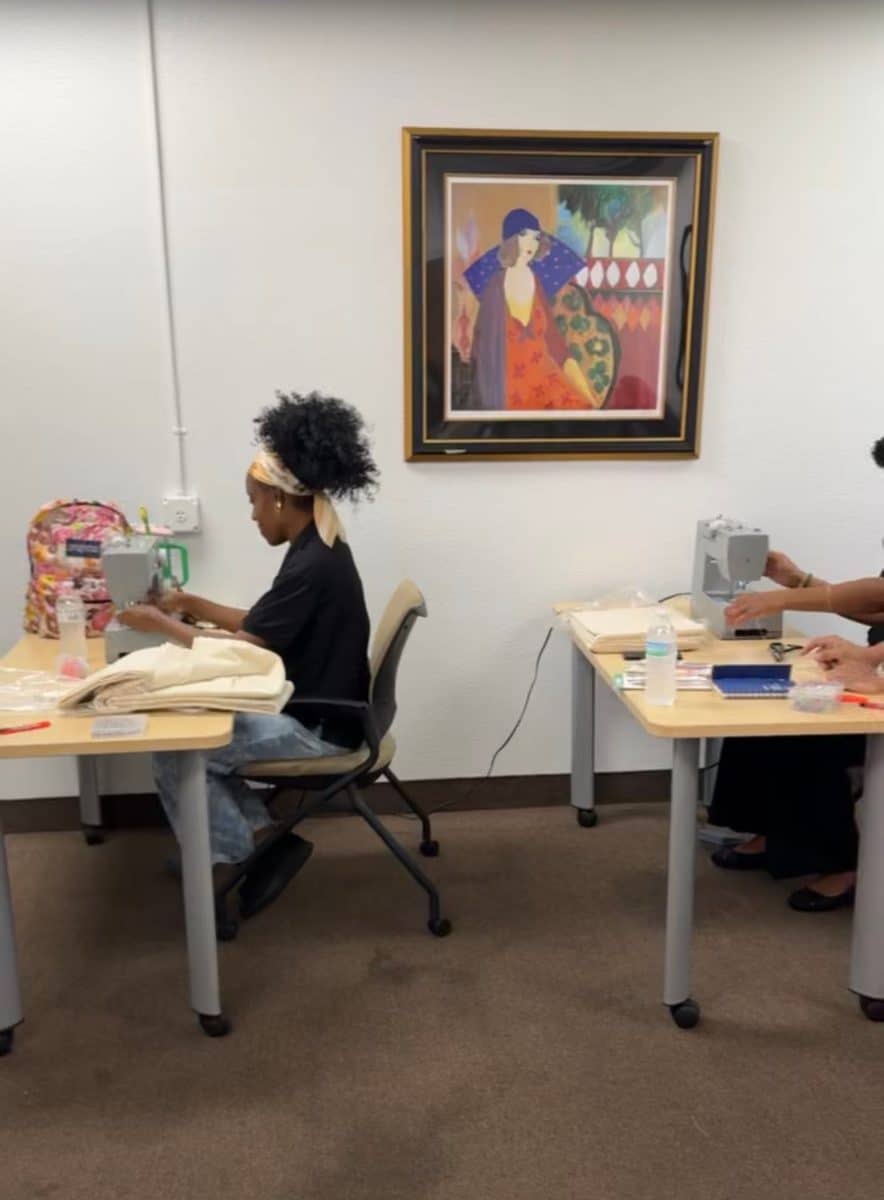 Women at their sewing machines during the Sewing for Success class
